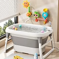 Kids Bathtub with Colorful Balls Rubber Duck and Cartoon Shower Toys Near Window