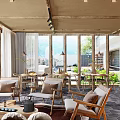 Elegant Rustic Hotel Lobby Interior With Stone Wall Fireplace Wooden Ceiling And Pendant Lights