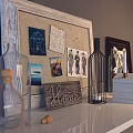 White Wall Mounted Shelf With Black Metal Brackets And Decorative Items On Gray Wall