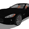 Black Maserati Sports Car With Orange Interior Sleek Design And Silver Wheels