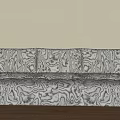 Poliform Three Seater Sofa With Abstract Black White Pattern On Light Colored Wall And Wooden Floor