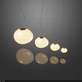 Modern Spherical Pendant Lights In Various Sizes With Warm Light And Floor Reflections
