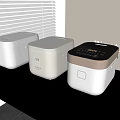 Modern Kitchen Appliances Three Rice Cookers With Different Designs On Black Countertop Minotli