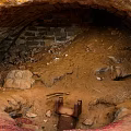 Natural Cave Interior With Dirt Floor Bricks And Metal Structure Elements