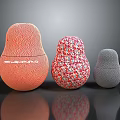 Decorative Matryoshka Style Objects With Orange Wavy Red White Speckled And Gray Dotted Textures