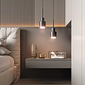 Modern Bedroom Interior With Two Pendant Lights And Decorative Items On Nightstand