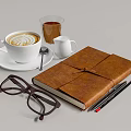 White Ceramic Coffee Cup With Latte Art Near Leather Notebook Eyeglasses And Pencils
