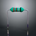 Green And Red Striped Resistor With Silver Metal Supports And Purple Ends On Black Background
