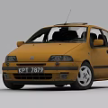 Yellow Compact Car With KPT 7879 License Plate Roof Antenna And Silver Alloy Wheels