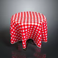 Round Dining Table With Red And White Checkered Tablecloth And Wooden Legs
