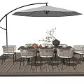 Stylish Outdoor Table with Arched Umbrella and Wicker Chairs on Wooden Deck with Vase Bowls