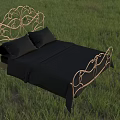 Ornate Golden Double Bed With Black Sheets And Pillows On Green Grass