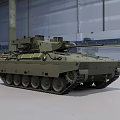 Green Military Tracked Armored Vehicle With Turret Cannon In Indoor Hangar