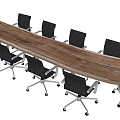 Long Wooden Conference Table With Black Wheeled Office Chairs In Modern Office