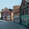 Traditional Commercial Street With Colorful European Style Buildings Cobblestone Road And Gabled Roofs