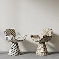 Stylish Modern Dining Chairs With Striped And Geometric Patterns Against Light Wall On Gray Floor