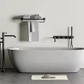 Modern Freestanding White Bathtub With Black Faucet Shower Fixture And Grey Towels On Rack