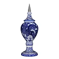 Blue and White Ceramic Vase With Golden Spire Top And Decorative Motifs