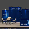 Blue Exhibition Booth With Display Panels Round Table White Chairs And Reception Desk