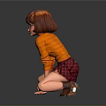 Kneeling Girl Sculpture Wearing Glasses Orange Top And Short Skirt On Reflective Ground