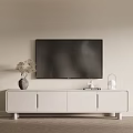 White TV Stand With Wall Mounted TV Decorative Vase Books And Lamp