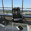 Black Ergonomic Office Chair In Modern Office With Large Windows And City View