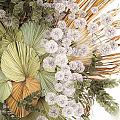 Artistic Natural Decorative Ornaments Arrangement With Green Fan Leaves White Clustered Blooms And Feathery Grass