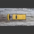 Yellow Van Model Parked on Snowy Platform with Detailed Exterior Design
