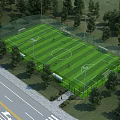 Aerial Planning of Soccer Field With Surrounding Trees Road Fencing and Lights