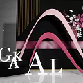 GKAL Letter Display With Pink Wavy Decorations And Flower Bouquet On Black Background