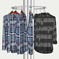 Stylish Plaid And Geometric Pattern Shirts Hanging On Metal Rotating Hanger