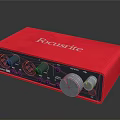 Red Focusrite Audio Interface with Control Knobs and Input Output Ports