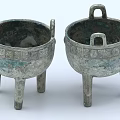 Two Traditional Ceramic Vessels With Three Legs Handles And Decorative Patterns Design