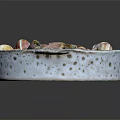 Snail Dish Served In Speckled White Bowl With Herbs And Vegetables