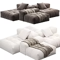 Modern Modular Sofa In White And Gray With Tufted Design Plush Cushions And Throw Blanket