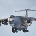 Military Fighter Jet With Four Engines Wide Wings And Landing Gear On Runway