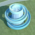 Blue Spiral Road Facility With Green Lawn And Trees Under Clear Sky