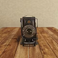 Vintage Style Digital Camera With Metal And Wooden Body On Wooden Table Top