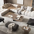 Modern Beige L shaped Sofa With Wooden Coffee Table Books Blanket And Black Accent Chairs