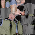 Elderly Man Waving Hand In Light Studio Wearing Green Vest Striped Shirt And Gray Pants