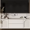 Modern White TV Stand with Cabinet Doors and Decorative Vase Under Wall Mounted TV