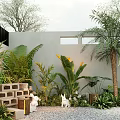 Tropical Outdoor Garden Plant Combination With Palm Trees Banana Leaves Brick Wall And Gravel Ground