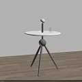 Modern Minimalist Side Table With Round White Tabletop Black Tripod Stand And Transparent Glass Cup