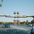 Modern Lubeo Entrance Gate With Spherical Ornaments Pillars And Landscaped Greenery