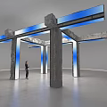 Art Installation Featuring Concrete Pillars And Blue Light Strips In Indoor Space With Person