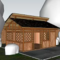 Wooden Cabin With Thatched Roof Lattice Windows Surrounded By Greenery Brick Wall And Gravel Ground