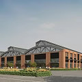 Industrial Factory Building With Red Brick Exterior Arched Roof Glass Windows And Greenery Area
