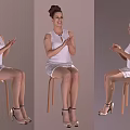 Woman Sitting On Stool Clapping Hands In White Dress With High Heels And Updo Hairstyle