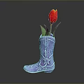 Blue Cowboy Boots with Star and Pattern Decorations Used as Flower Vase Holding Red Tulip