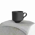 Black Ceramic Cup With Handle Placed On Textured Patterned Cloth Surface 3d model